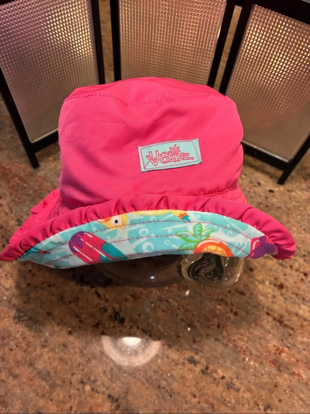 UV Skinz Reversible Bucket Hat Pink side/tropical pattern side UPF 50+, size 6